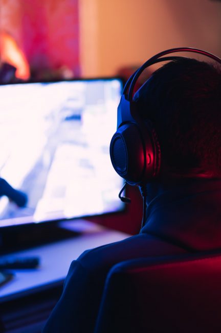 man in red shirt wearing black headphones