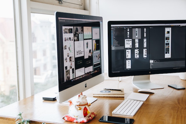 silver imac on brown wooden table